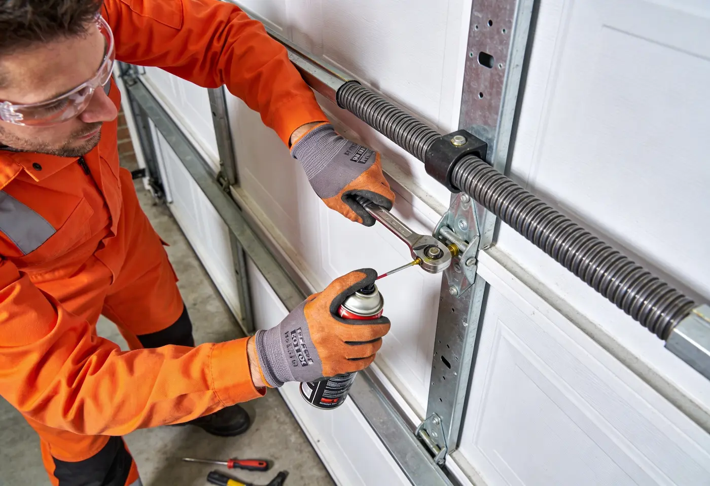 Residential garage door where roller replacement cost depends on door size and roller type