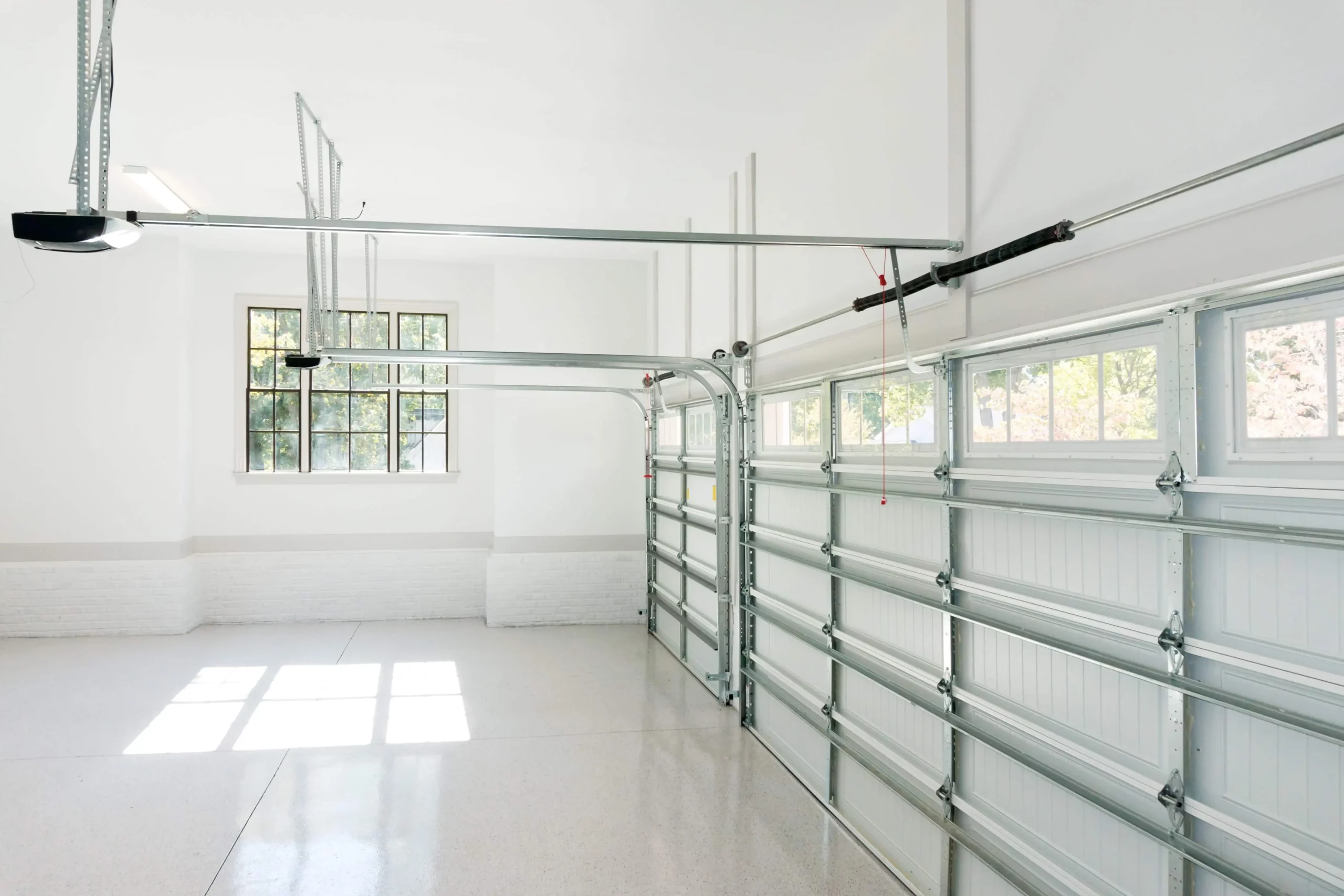 Modern garage door with quiet nylon rollers keeping garage door roller replacement cost predictable